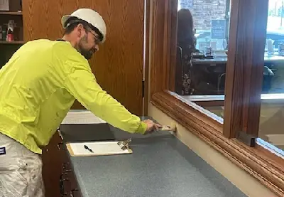 A painter is seen at work. Mid-Illinois Companies performs commercial painting in Macomb IL.